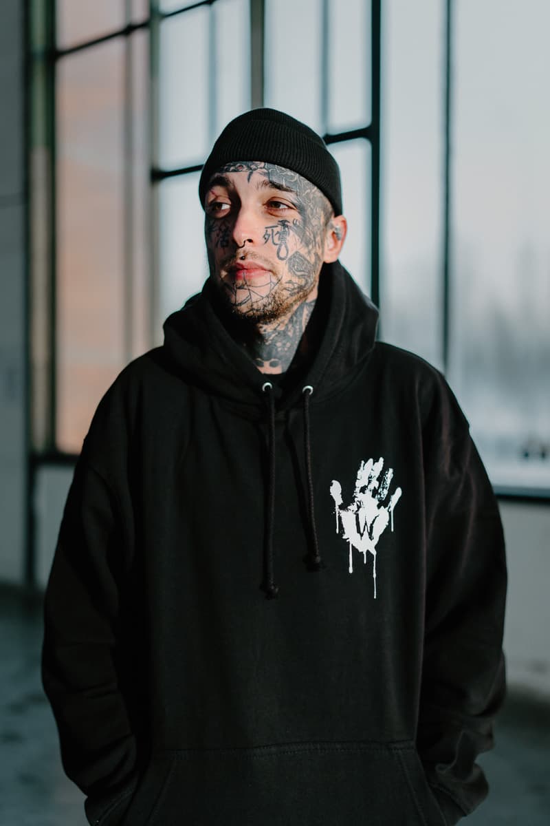 Black hoodie with WOLF MOTEL HOODIE UNISEX print - Wolfpack Clothing