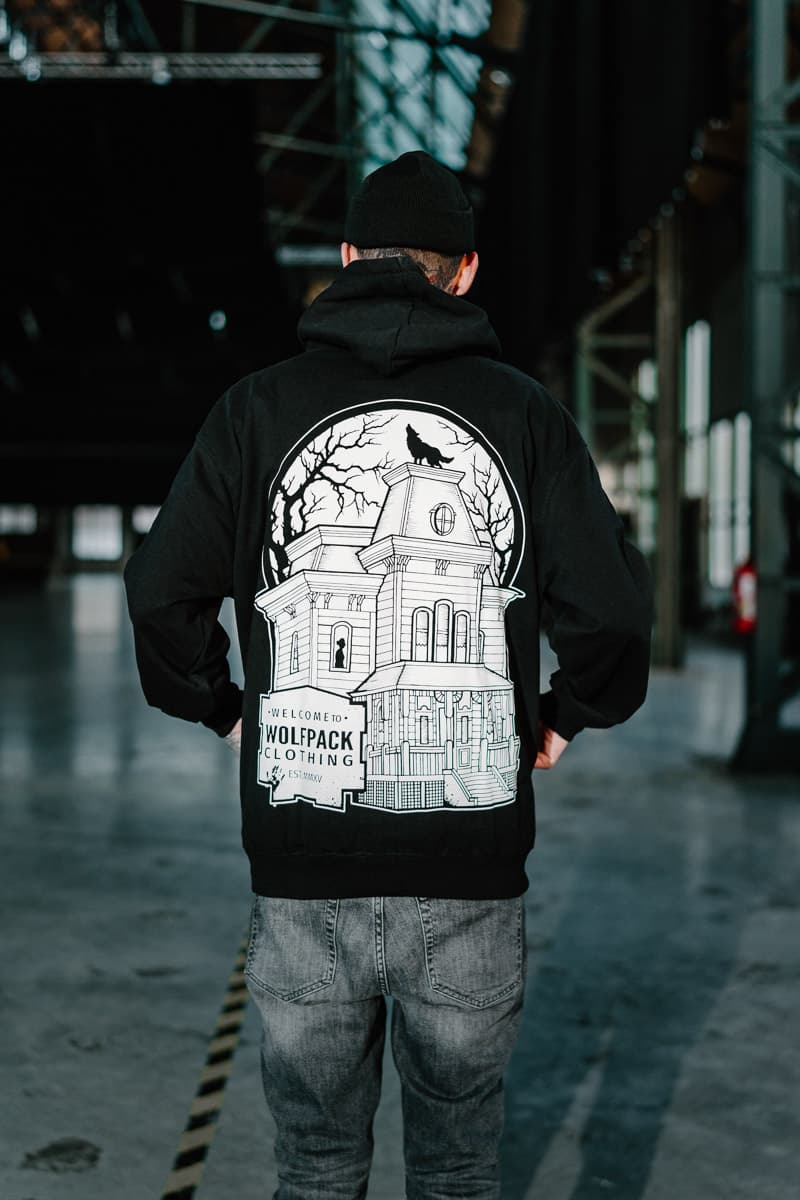 Black hoodie with WOLF MOTEL HOODIE UNISEX print - Wolfpack Clothing