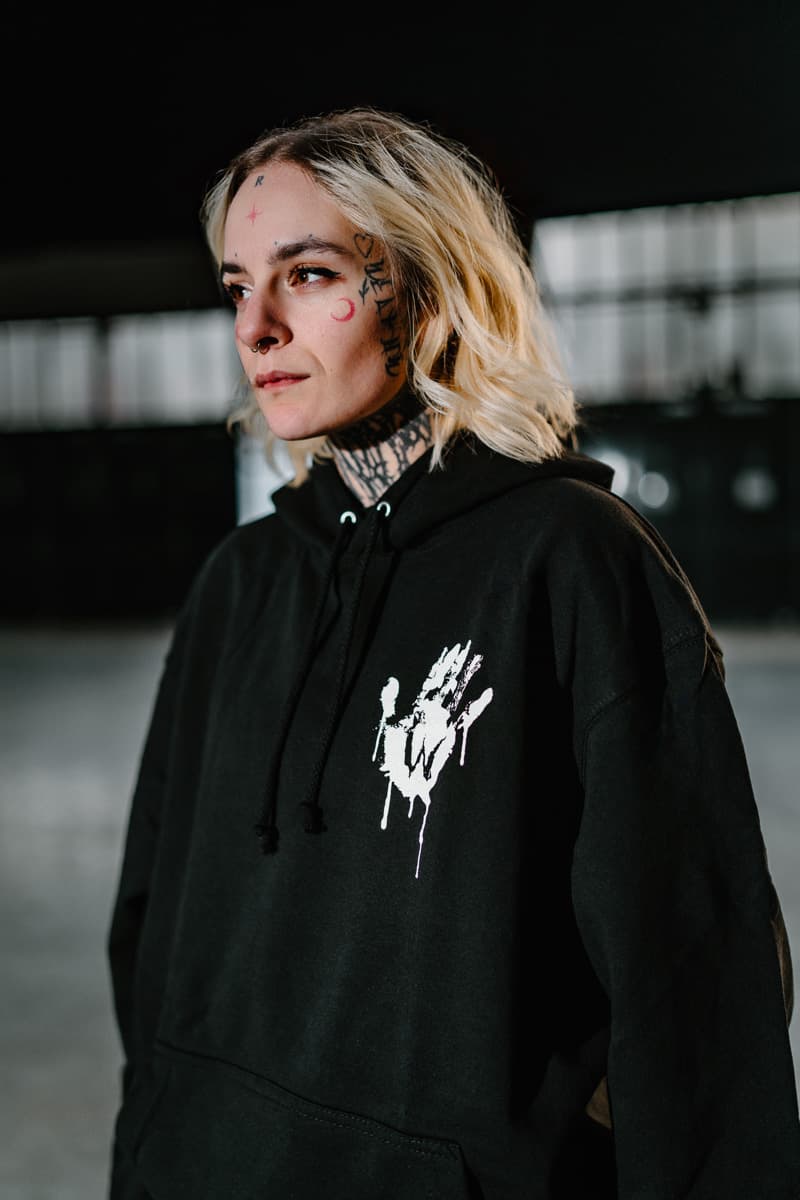 Black hoodie with WOLF MOTEL HOODIE UNISEX print - Wolfpack Clothing