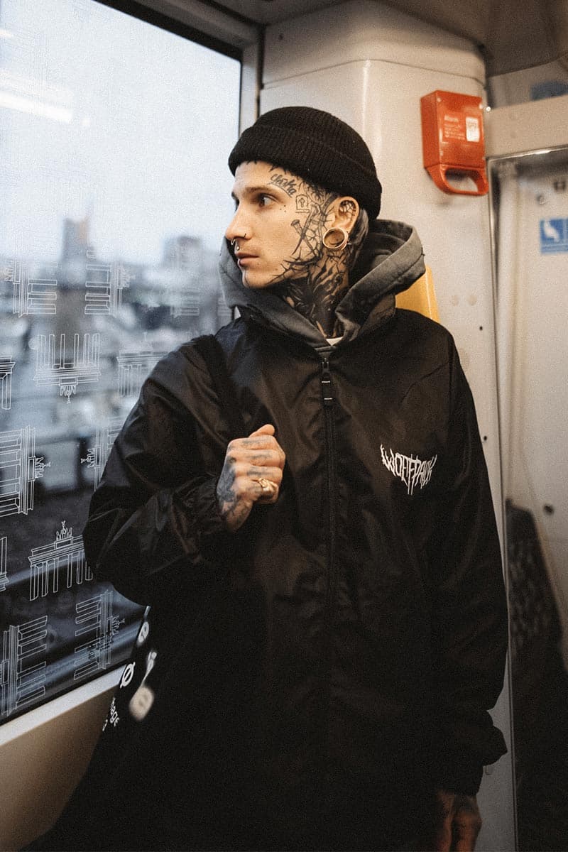 Black windbreaker with WOLFPACK WINDBREAKER UNISEX print - Wolfpack Clothing