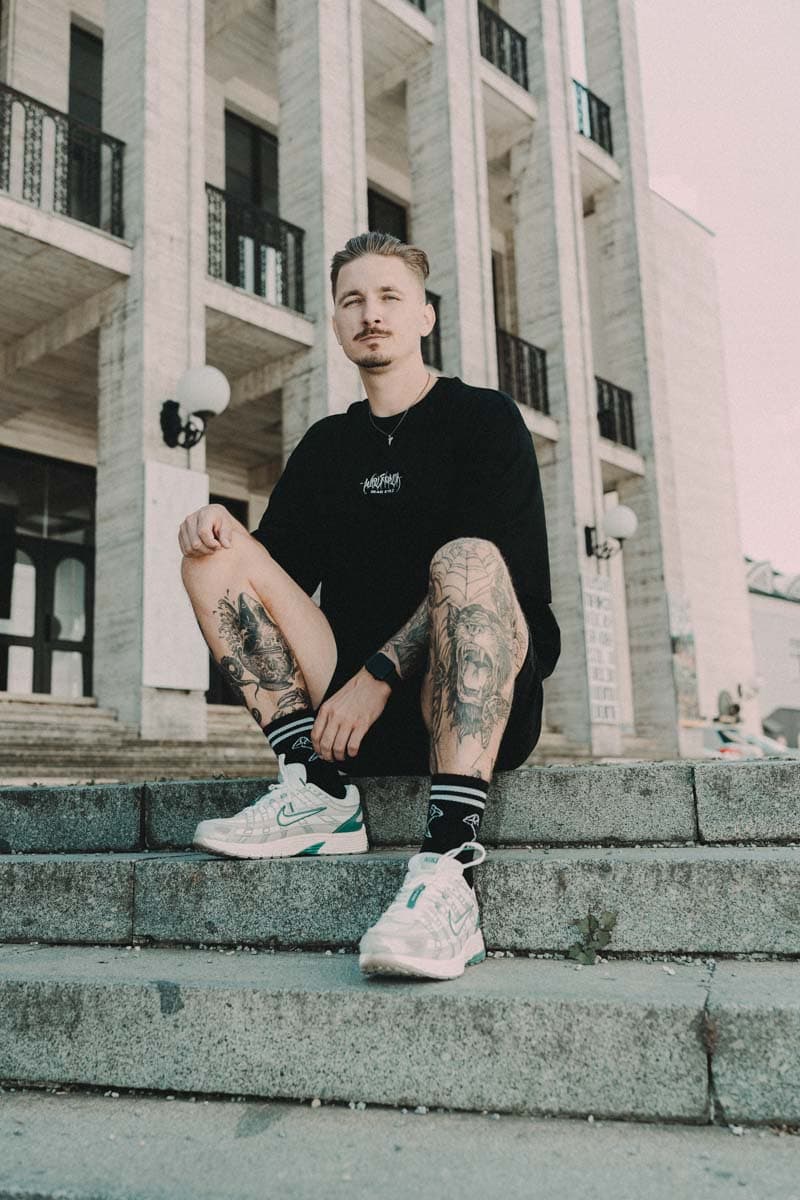 Black oversized t-shirt with SACRED SILENCE OVERSIZED TEE UNISEX print - Wolfpack Clothing