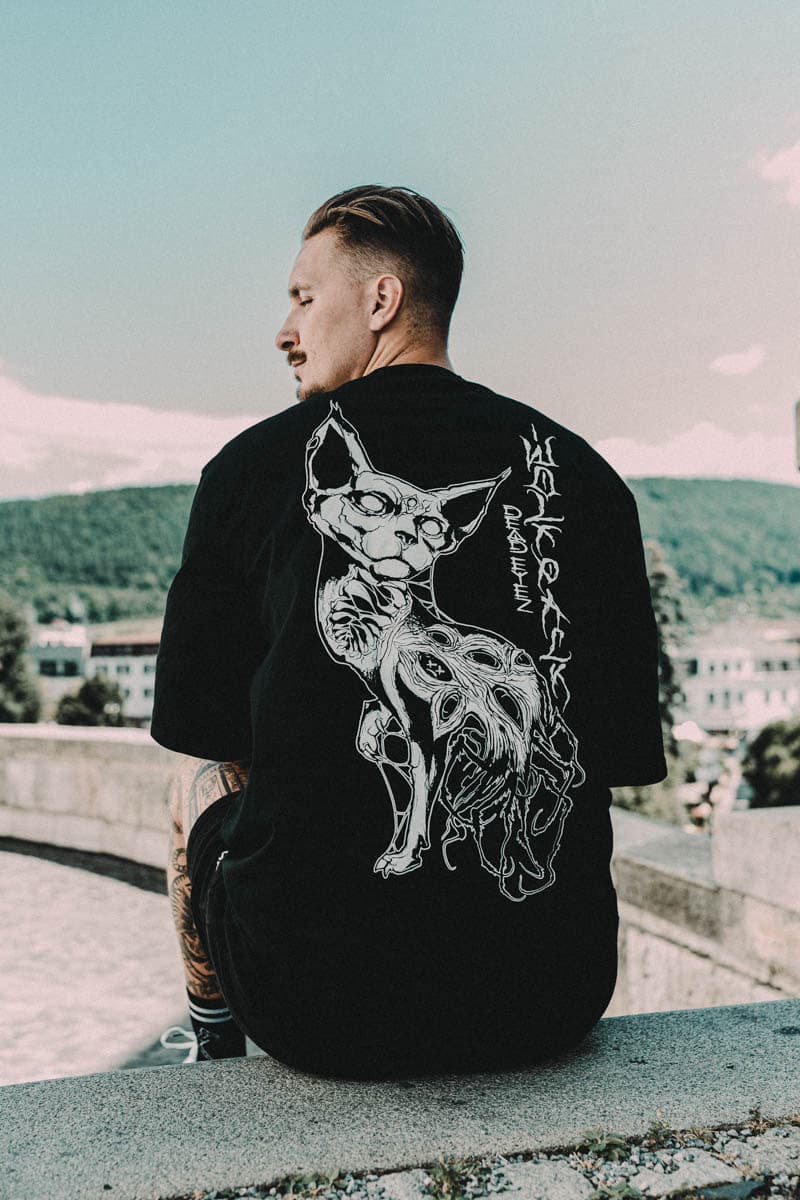 Black oversized t-shirt with SACRED SILENCE OVERSIZED TEE UNISEX print - Wolfpack Clothing