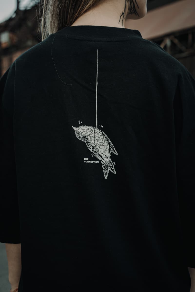 Black oversized t-shirt with CONNECTION OVERSIZED TEE UNISEX print - Wolfpack Clothing
