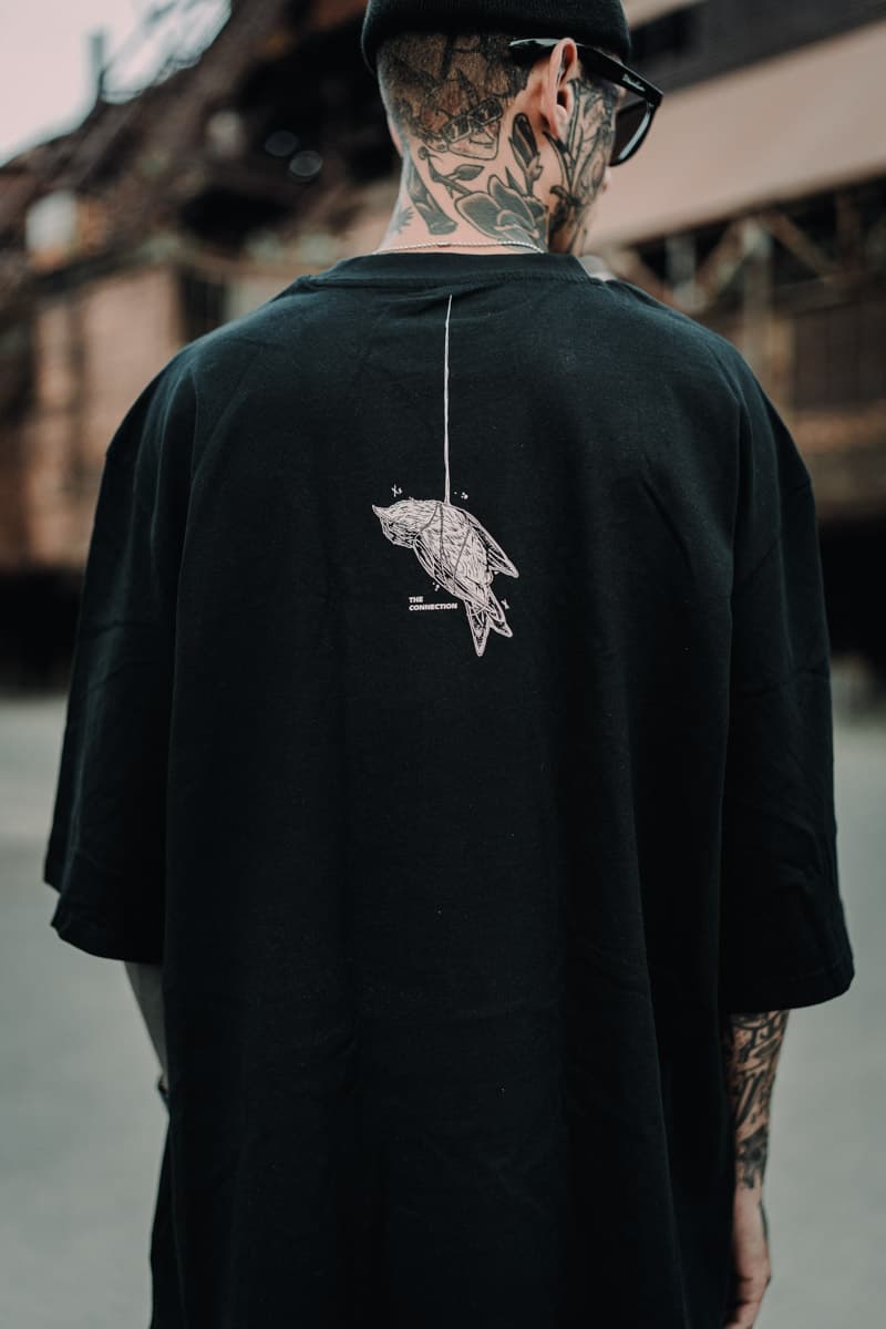 Black oversized t-shirt with CONNECTION OVERSIZED TEE UNISEX print - Wolfpack Clothing