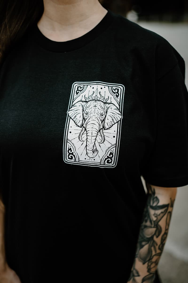 Black t-shirt with ROYAL TUSKS TEE UNISEX print - Wolfpack Clothing
