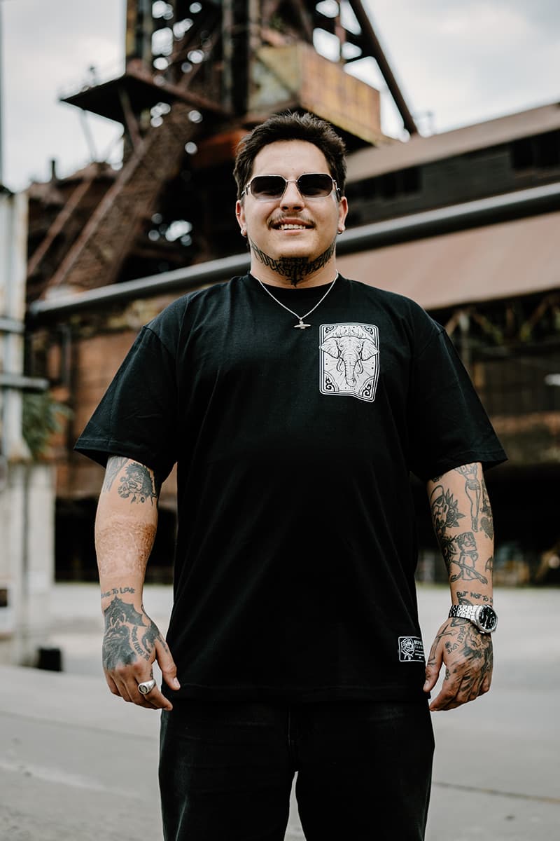 Black t-shirt with ROYAL TUSKS TEE UNISEX print - Wolfpack Clothing