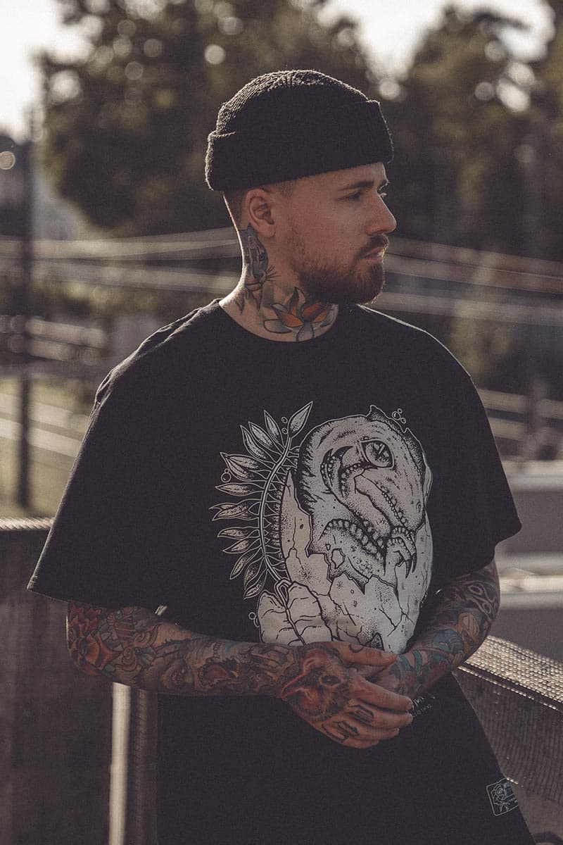 Black t-shirt with THE NEWBORN TEE UNISEX print - Wolfpack Clothing