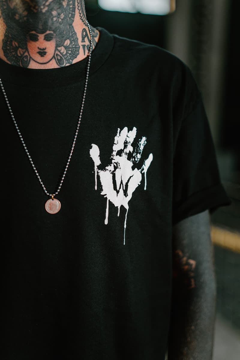 Black t-shirt with WOLF MOTEL TEE UNISEX print - Wolfpack Clothing