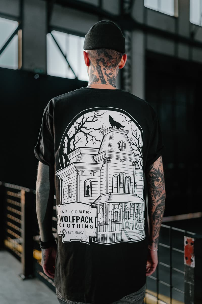 Black t-shirt with WOLF MOTEL TEE UNISEX print - Wolfpack Clothing