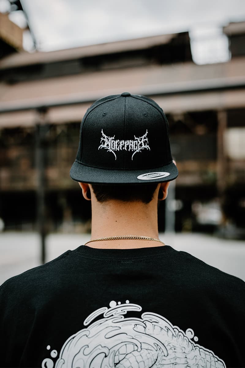 Black hat with BLACK LOTUS SNAPBACK print - Wolfpack Clothing