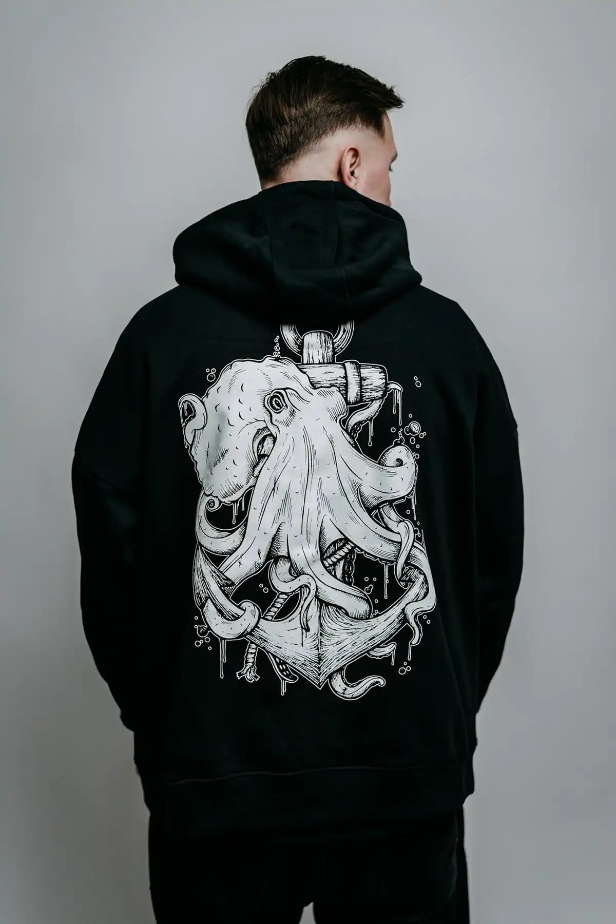 Black oversized hoodie with THE CHOKER OVERSIZED HOODIE UNISEX print - Wolfpack Clothing