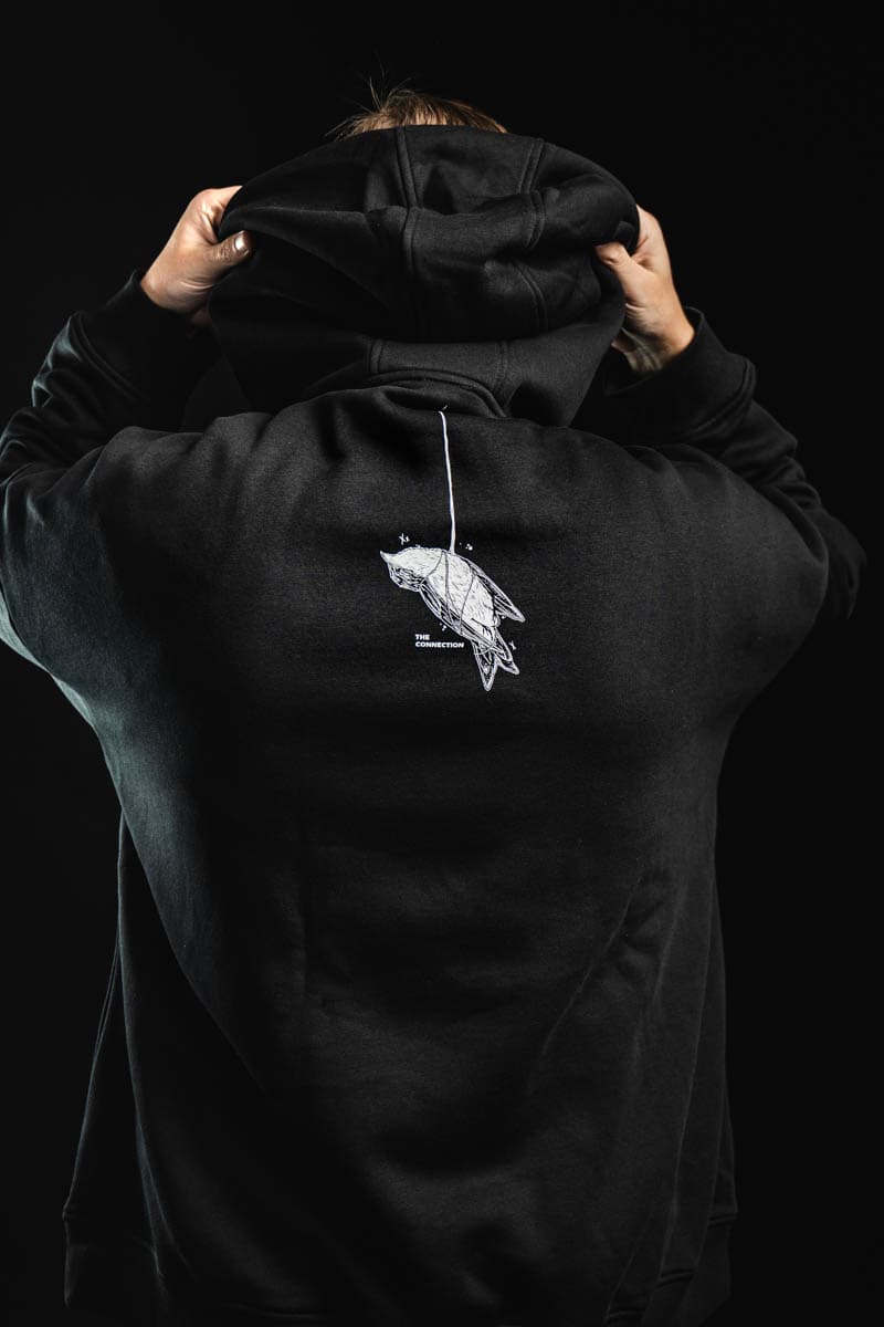 Black oversized hoodie with CONNECTION OVERSIZED HOODIE UNISEX print - Wolfpack Clothing