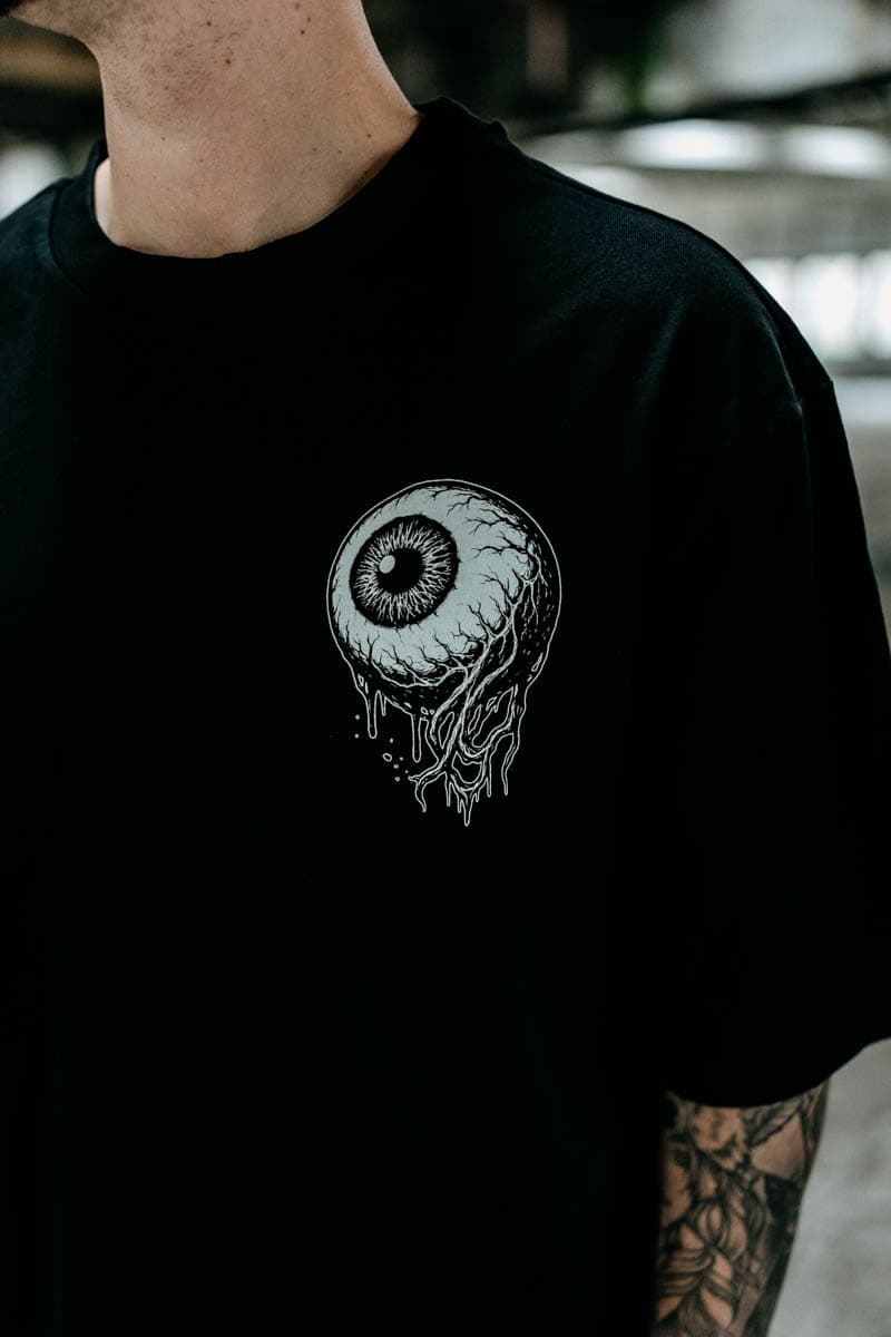 Black oversized t-shirt with INNER EYE OVERSIZED TEE UNISEX print - Wolfpack Clothing