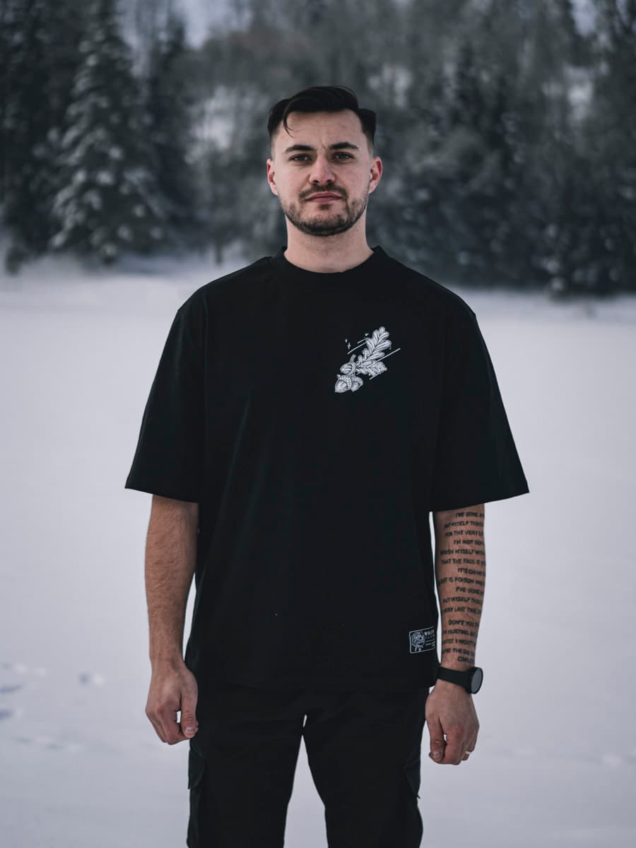 Black oversized t-shirt with NORDIC HUNTER OVERSIZED TEE UNISEX print - Wolfpack Clothing