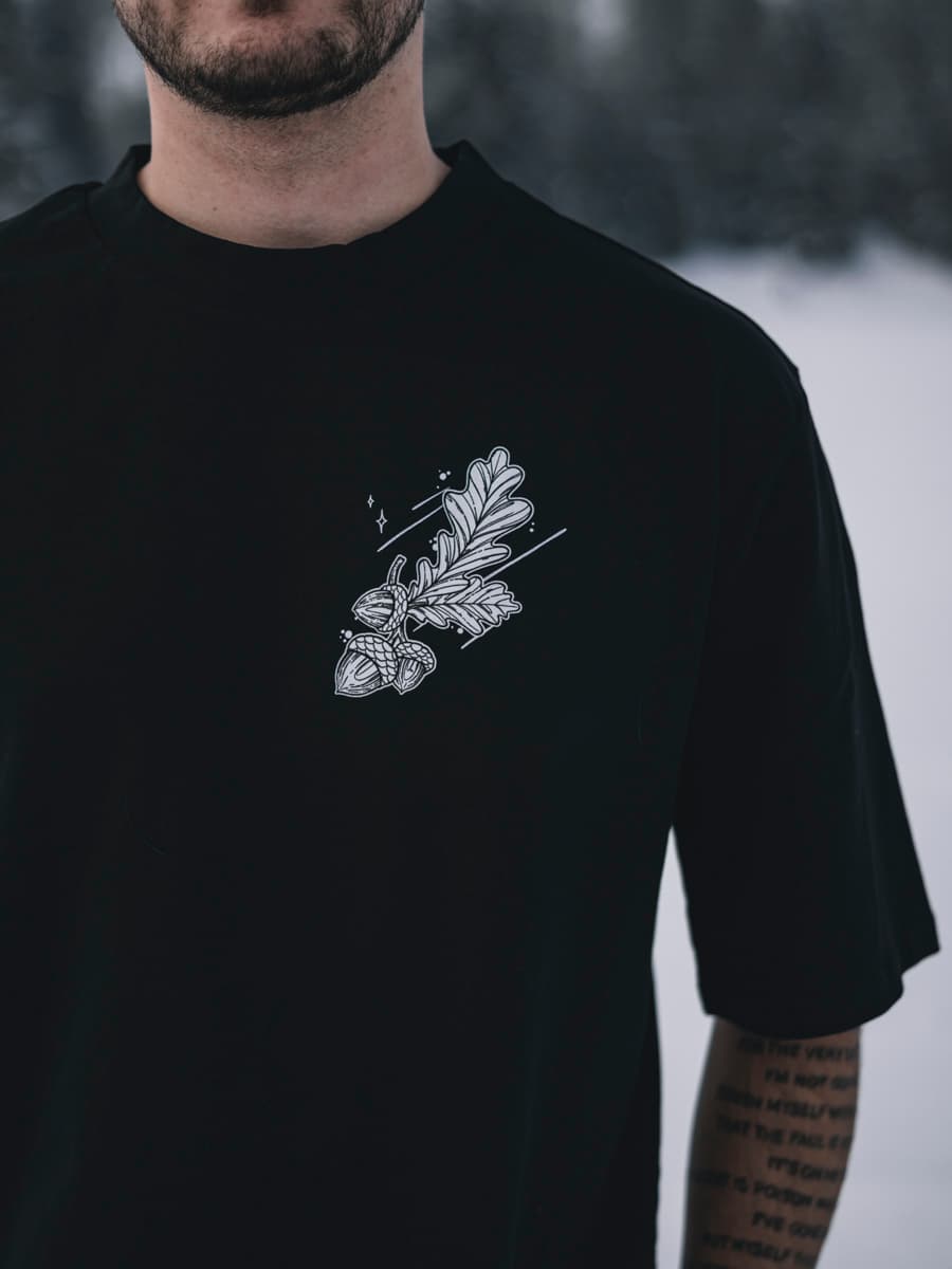 Black oversized t-shirt with NORDIC HUNTER OVERSIZED TEE UNISEX print - Wolfpack Clothing