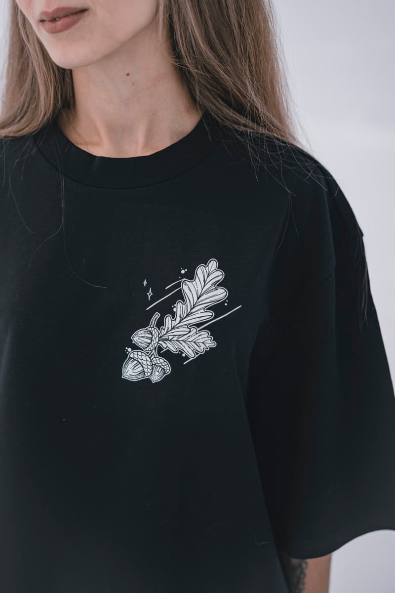 Black oversized t-shirt with NORDIC HUNTER OVERSIZED TEE UNISEX print - Wolfpack Clothing