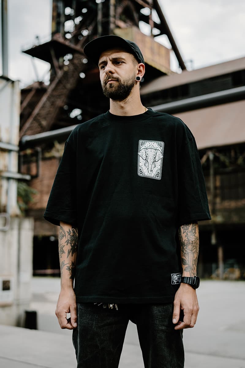 Black oversized t-shirt with ROYAL TUSKS OVERSIZED TEE UNISEX print - Wolfpack Clothing