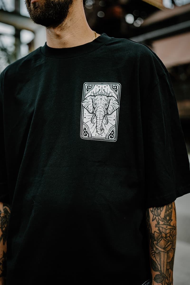 Black oversized t-shirt with ROYAL TUSKS OVERSIZED TEE UNISEX print - Wolfpack Clothing