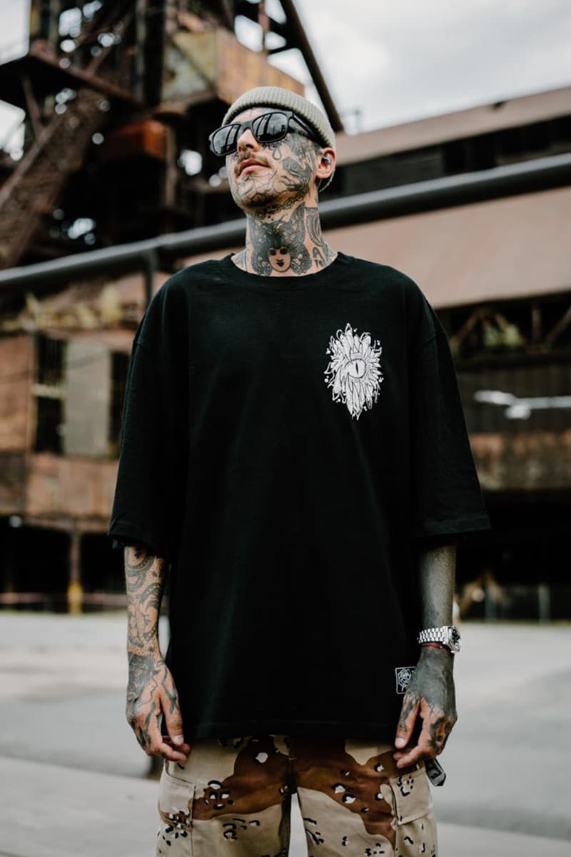 Black oversized t-shirt with SCALES & SILENCE OVERSIZED TEE UNISEX print - Wolfpack Clothing